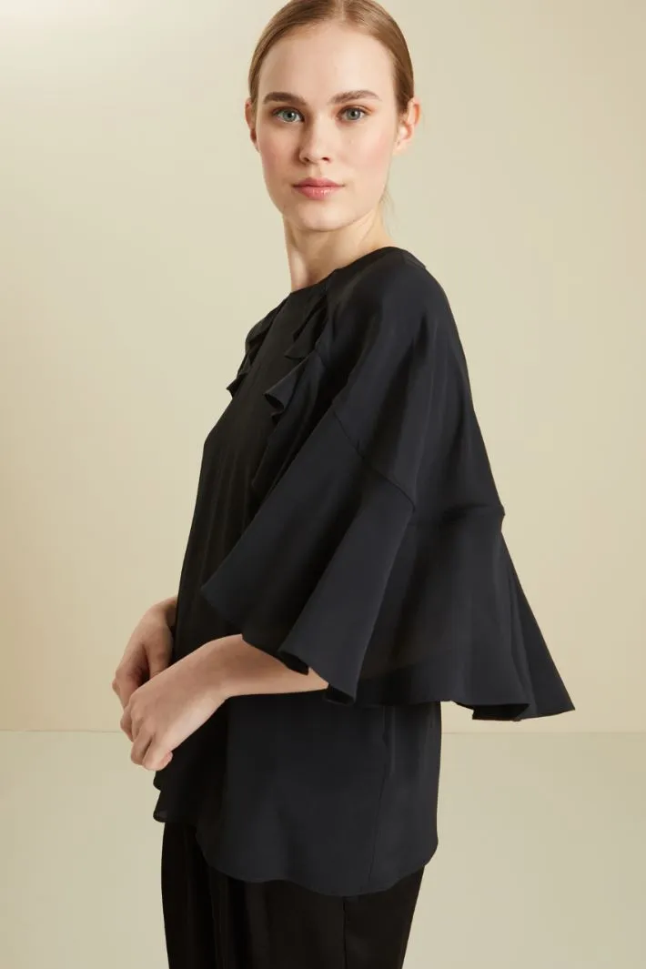 Blusa con volant
