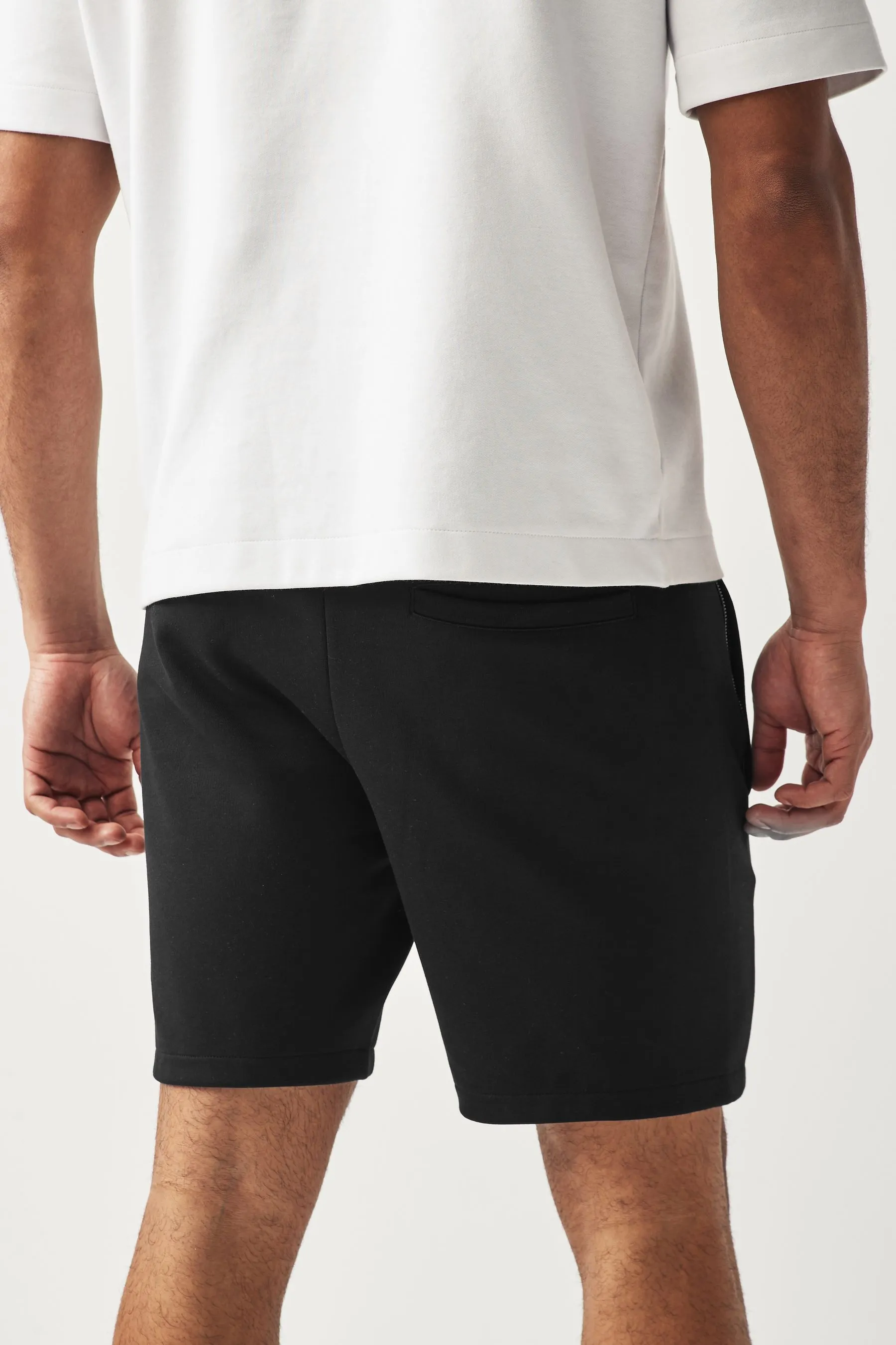 Shorts in jersey con tasche con zip